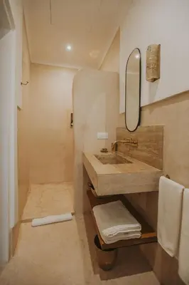 a bathroom with a sink and a mirror at Riad Babel au coeur de la Médina in Marrakech
