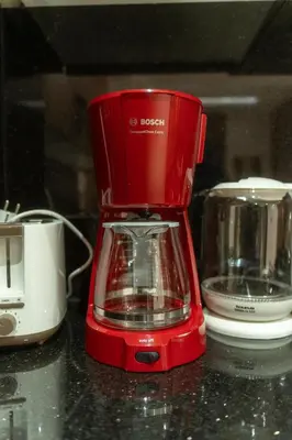 a red blender sitting on top of a counter at Royal KING Bed SUITE W/POOL in Marrakech