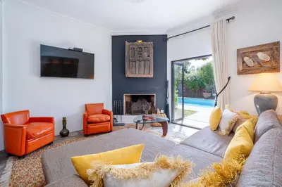a living room with a couch and a fireplace at Private Villa Comfort & Relax-Heated Pool in Marrakech