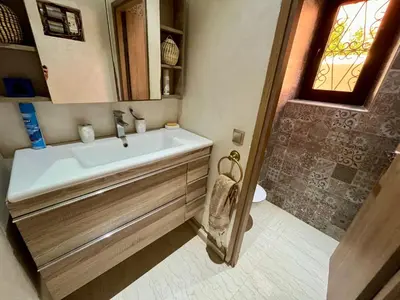 a bathroom with a sink and a shower at Villa Al Nour avec piscine in Marrakech