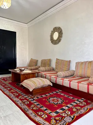 a living room with a couch and a table at Cozy Apartment In Marrakech in Marrakech