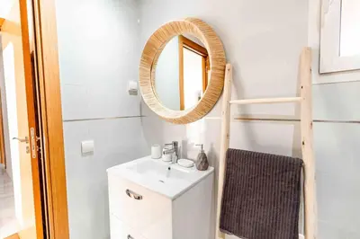 a bathroom with a sink and a mirror at Appartement Luxe Riad Garden Marrakech 3 piscines in Marrakech