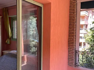 a glass door to a balcony on a building at Appartement de prestige au quartier de l’Hivernage, Marrakech in Marrakech