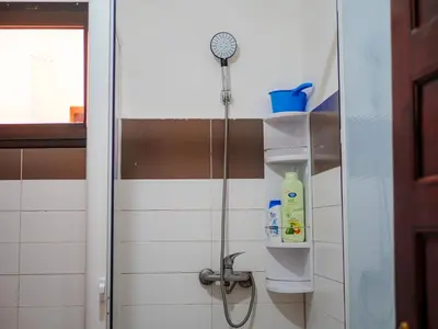 a shower in a bathroom with a glass door at Family Illuminated Apartment With Pool in Marrakech