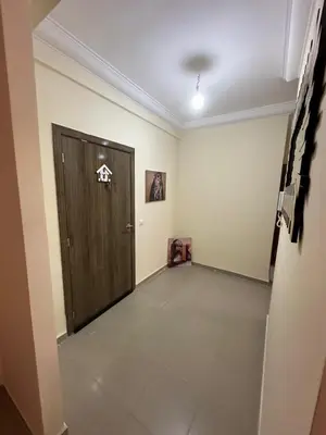 a hallway with a wooden door in a room at Marrakech airport apartment in Marrakech