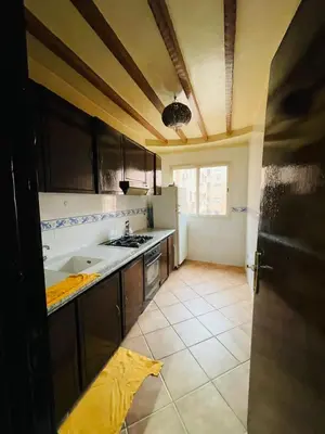 a kitchen with a sink and a stove at Big Gardens 3 in Marrakech