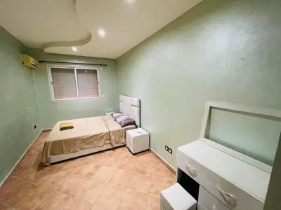 a small room with a bed and a window at Big Gardens 3 in Marrakech