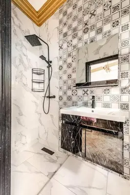 a bathroom with a sink and a mirror at 16 Riads in Marrakech