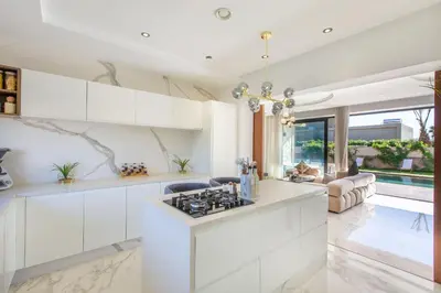 a kitchen with white cabinets and a stove at Palais Rafi in Marrakech