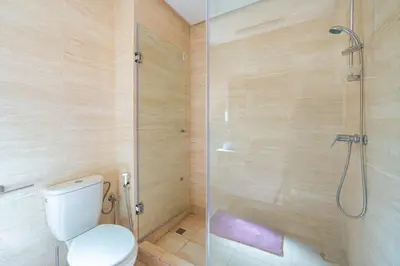 a bathroom with a toilet and a glass shower at Exceptional Style Nonstop Luxury in Marrakech
