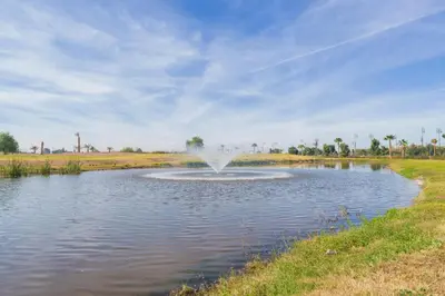 a fountain in the middle of a pond in a field at Relax Front Of Pool-Garden-Fibre in Marrakech