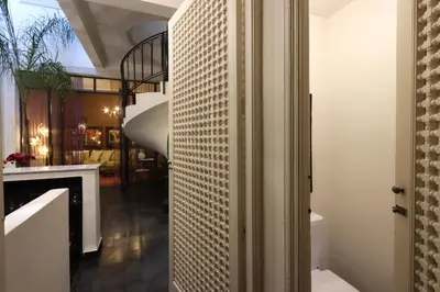 a hallway with a staircase in a house at Riad Garden House Marrakech in Marrakech