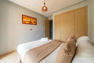 a bedroom with a bed and a couch at Relaxing Summer-Pool-Garden-Wifi in Marrakech