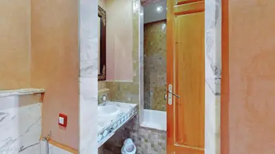a bathroom with a sink and a mirror at Appartements de charme à la palmeraie in Marrakech