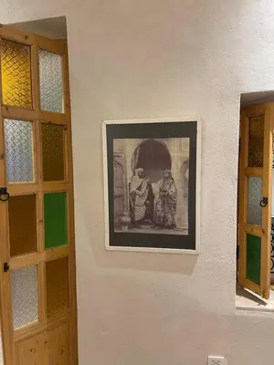 a picture of two people on the side of a wall at Riad212 private medina fast Wi-Fi plunge pool in Marrakech