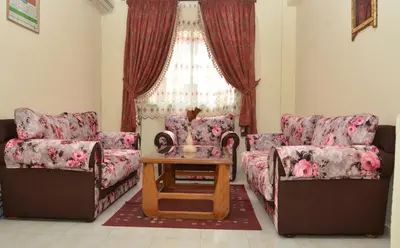a living room with two couches and a table at Cheap accommodation in Marrakech in Marrakech