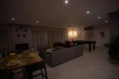 a living room with a couch and a pool table at Loft Atlas in Marrakech
