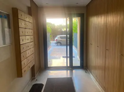 an empty hallway with a door to a parking lot at Appart de standing + piscine sur le toit in Marrakech