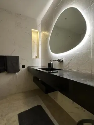 a bathroom with a sink and a mirror at magnifique villa golf amelkis sans vis-à-vis in Marrakech