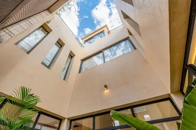 an interior view of a house with large windows at Villa Tolède by TheCasaEdition in Marrakech