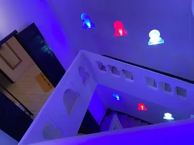 a room with red and blue lights on the ceiling at Riad Ayiss piscine palmeraie in Marrakech
