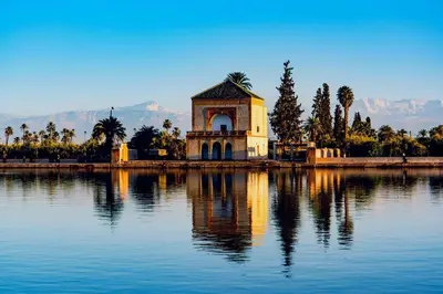 a building sitting in the middle of a lake at The Vogue – Marrakech Centre in Marrakech