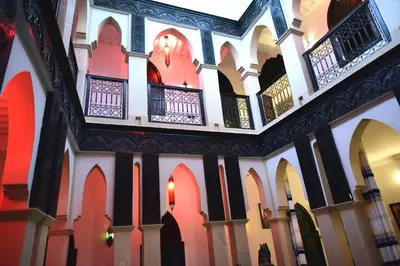 a view of the inside of a building with arches at Ryad Laârouss in Marrakech