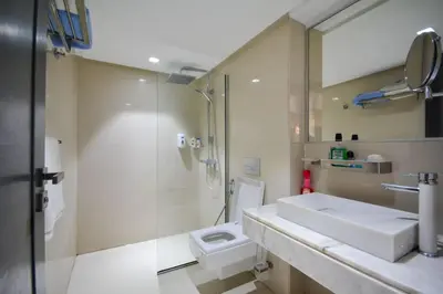 a bathroom with a sink and a shower and a toilet at Luxueux Duplex 2CH dans une magnifique résidence in Marrakech