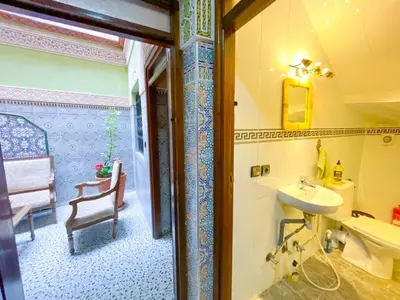 a bathroom with a sink and a toilet at Dar Amane - Charmante maison marocaine in Marrakech