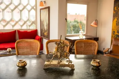 a table with a statue on top of it at LUXURY apartment in Marrakech