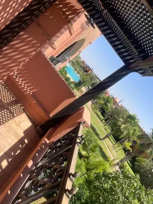 an overhead view of a building with a swimming pool at Strasmarrakech in Marrakech