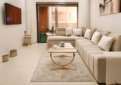 a living room with a couch and a coffee table at Appart vacance safaa in Marrakech