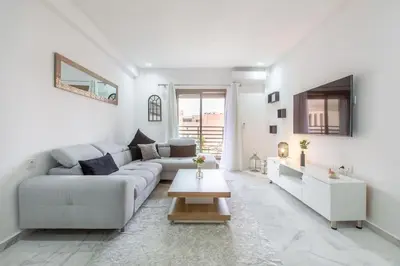a white living room with a couch and a table at New! Guéliz , Modern , Terrasse in Marrakech
