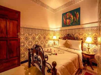 a bedroom with a large bed in a room at Pretty Apartment in the Medina in Marrakech