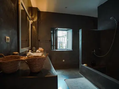 a bathroom with a sink and a mirror at Riad La Smala in Marrakech
