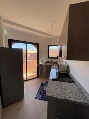 a kitchen with a sink and a counter top at Appartement Moderne Premium in Marrakech