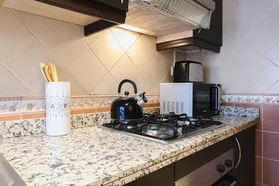 a kitchen counter with a tea pot on a stove at Art Elegance – Downtown in Marrakech