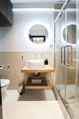 a bathroom with a sink and a glass shower at Art Elegance – Downtown in Marrakech