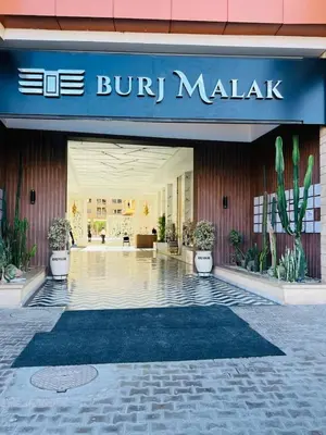 a lobby of a building with a sign on it at Calista Appart hotel piscine in Marrakech