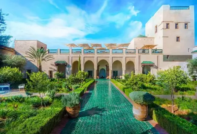 a courtyard of a building with a swimming pool at La Dolce Casa – Private Pool in Marrakech