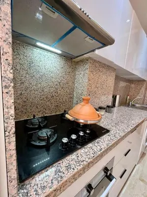 a kitchen with a stove with a pot on it at Yumo: The Cozy One in Marrakech