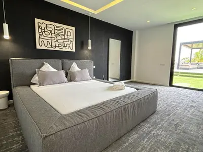 a bedroom with a large bed in a room at Palais Kahli in Marrakech
