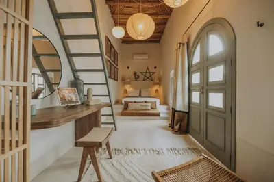 a room with a staircase leading to a bedroom at Riad Dar M in Marrakech