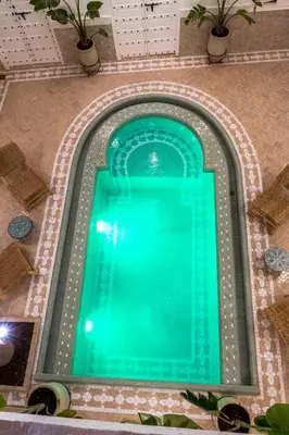 an overhead view of a swimming pool in a building at Riad Zayn & Spa in Marrakech