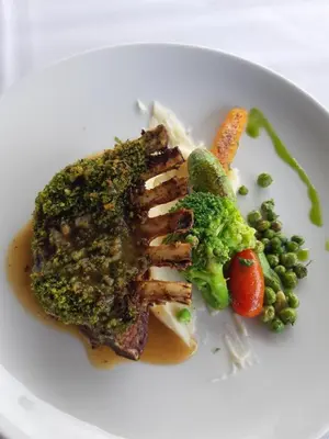 a plate of food with broccoli and vegetables on it at THE FARM LODGES & Private pool in Marrakech