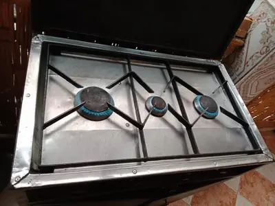 a stove with three burners on top of it at Airport Home in Marrakech