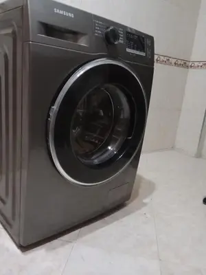 a washing machine is sitting in a room at Airport Home in Marrakech