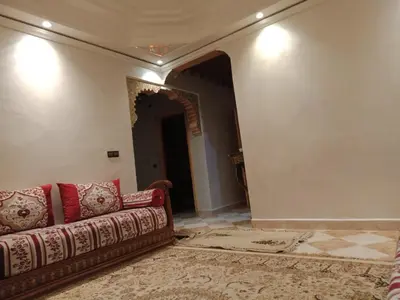 a living room with a couch and a rug at Airport Home in Marrakech