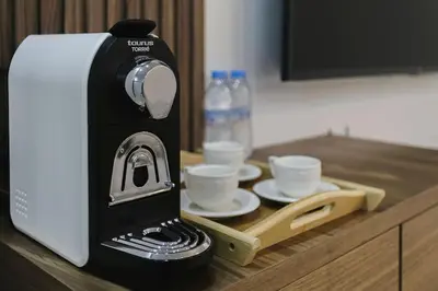 a coffee maker sitting on top of a counter at Golden Skyline – Marrakech in Marrakech