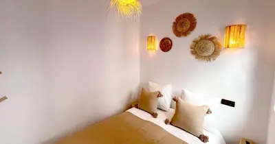 a bedroom with a bed with two pillows on it at Couloirs de la Médina in Marrakech